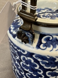 A Chinese polished purple Yixing stoneware covered teapot for the Thai market and a blue and white covered teapot, 19th C.