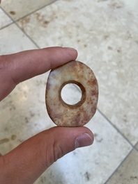 A collection of 16 Chinese neolithic jade 'bi' discs, probably Shang