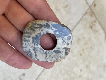 A collection of 16 Chinese neolithic jade 'bi' discs, probably Shang