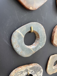 A collection of 16 Chinese neolithic jade 'bi' discs, probably Shang