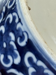 A Chinese polished purple Yixing stoneware covered teapot for the Thai market and a blue and white covered teapot, 19th C.