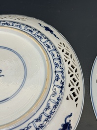 A pair of Chinese blue and white plates with floral design and reticulated border, conical shell mark, Kangxi