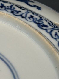 A pair of Chinese blue and white plates with floral design and reticulated border, conical shell mark, Kangxi