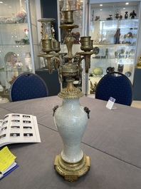 A pair of Chinese blue and white Nanking crackle-glazed vases with gilt bronze candelabra mounts, 19th C.