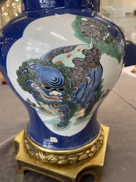 A Chinese famille verte  powder-blue-ground 'mythical animal' vase with gilt bronze lamp mounts, 19th C.