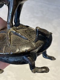 A Chinese bronze candle or incense holder in the shape of a crane standing on a turtle and a Tibetan vajra, Ming/Qing