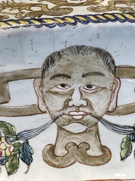 A large Chinese Canton enamel basin with garlands decorated with male heads, Qianlong