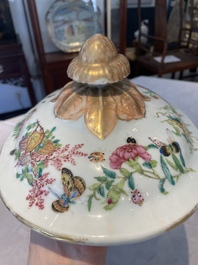 A Chinese Canton famille rose covered tureen on stand with flowers, fruits and insects, 19th C.