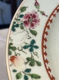 A Chinese famille rose dish and four plates with floral design, Qianlong