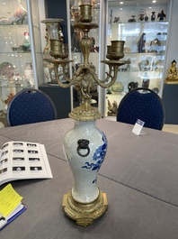 A pair of Chinese blue and white Nanking crackle-glazed vases with gilt bronze candelabra mounts, 19th C.