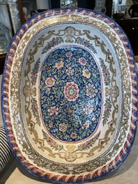 A large Chinese Canton enamel basin with garlands decorated with male heads, Qianlong