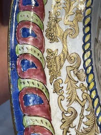 A large Chinese Canton enamel basin with garlands decorated with male heads, Qianlong