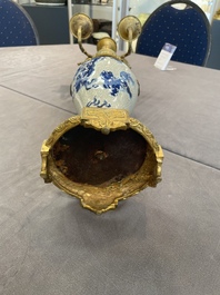 A pair of Chinese blue and white Nanking crackle-glazed vases with gilt bronze candelabra mounts, 19th C.