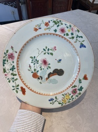 A Chinese famille rose dish and four plates with floral design, Qianlong