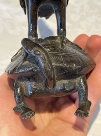 A Chinese bronze candle or incense holder in the shape of a crane standing on a turtle and a Tibetan vajra, Ming/Qing