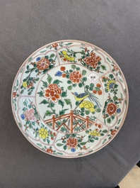 A pair of Chinese famille verte 'bird and peonies' plates, Kangxi