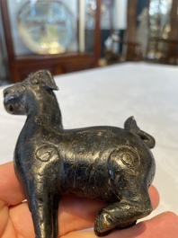 A pair of Chinese bronze mythical creatures and two ewers, Ming