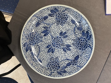 A pair of Chinese blue and white 'peony' dishes, Chenghua mark, 19th C.