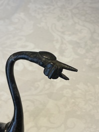 A Chinese bronze candle or incense holder in the shape of a crane standing on a turtle and a Tibetan vajra, Ming/Qing