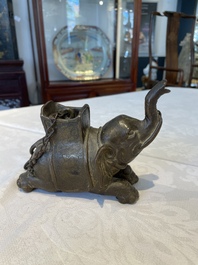 A pair of Chinese bronze mythical creatures and two ewers, Ming