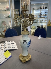 A pair of Chinese blue and white Nanking crackle-glazed vases with gilt bronze candelabra mounts, 19th C.