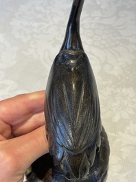 A Chinese bronze candle or incense holder in the shape of a crane standing on a turtle and a Tibetan vajra, Ming/Qing