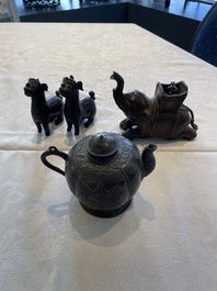 A pair of Chinese bronze mythical creatures and two ewers, Ming
