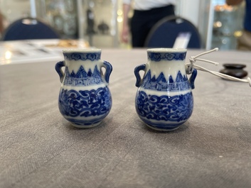 A pair of Chinese blue and white miniature 'hu' vases on wooden stands, Kangxi mark, 19th C.