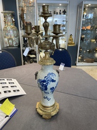 A pair of Chinese blue and white Nanking crackle-glazed vases with gilt bronze candelabra mounts, 19th C.