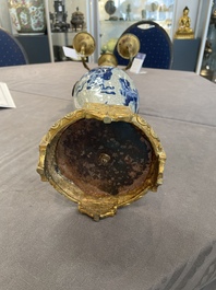 A pair of Chinese blue and white Nanking crackle-glazed vases with gilt bronze candelabra mounts, 19th C.