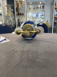 A Chinese famille verte  powder-blue-ground 'mythical animal' vase with gilt bronze lamp mounts, 19th C.