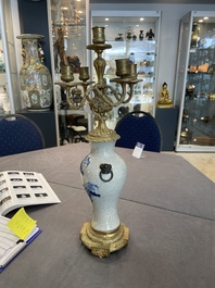 A pair of Chinese blue and white Nanking crackle-glazed vases with gilt bronze candelabra mounts, 19th C.