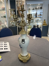 A pair of Chinese blue and white Nanking crackle-glazed vases with gilt bronze candelabra mounts, 19th C.
