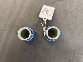 A pair of Chinese blue and white miniature 'hu' vases on wooden stands, Kangxi mark, 19th C.