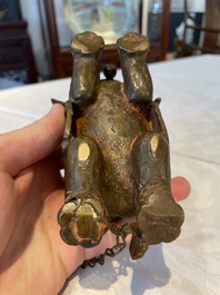 A pair of Chinese bronze mythical creatures and two ewers, Ming