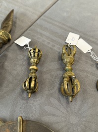 A varied collection of Tibetan bronze, iron and copper alloy ritual instruments, 14th C. and later