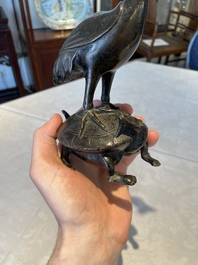 A Chinese bronze candle or incense holder in the shape of a crane standing on a turtle and a Tibetan vajra, Ming/Qing