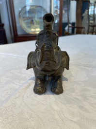 A pair of Chinese bronze mythical creatures and two ewers, Ming