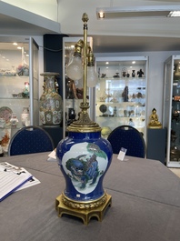 A Chinese famille verte  powder-blue-ground 'mythical animal' vase with gilt bronze lamp mounts, 19th C.