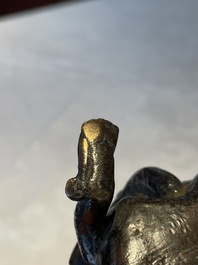 A Chinese bronze candle or incense holder in the shape of a crane standing on a turtle and a Tibetan vajra, Ming/Qing