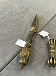 A varied collection of Tibetan bronze, iron and copper alloy ritual instruments, 14th C. and later