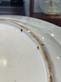 A Chinese famille rose dish and four plates with floral design, Qianlong