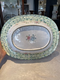 A large Chinese Canton enamel basin with garlands decorated with male heads, Qianlong