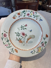 A Chinese famille rose dish and four plates with floral design, Qianlong