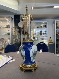 A Chinese famille verte  powder-blue-ground 'mythical animal' vase with gilt bronze lamp mounts, 19th C.