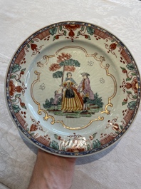 A Chinese famille rose dish, two plates and a Dutch-decorated plate, Qianlong