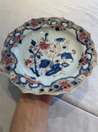 Two sets of six Chinese famille rose plates with peonies, Yongzheng/Qianlong