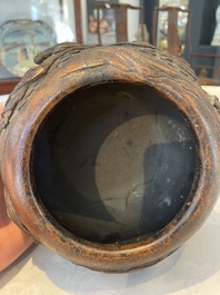 A Chinese agarwood brush washer with landscape relief design on wooden stand, 17/18th C.