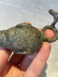 A bronze urn, a bronze canteen with relief design and a pair of bronze oil lamps, Roman Empire, 9th C. B.C/5th C.
