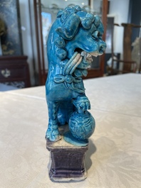 Three Chinese turquoise-glazed vases and a turquoise and aubergine-glazed Buddhist lion, Kangxi